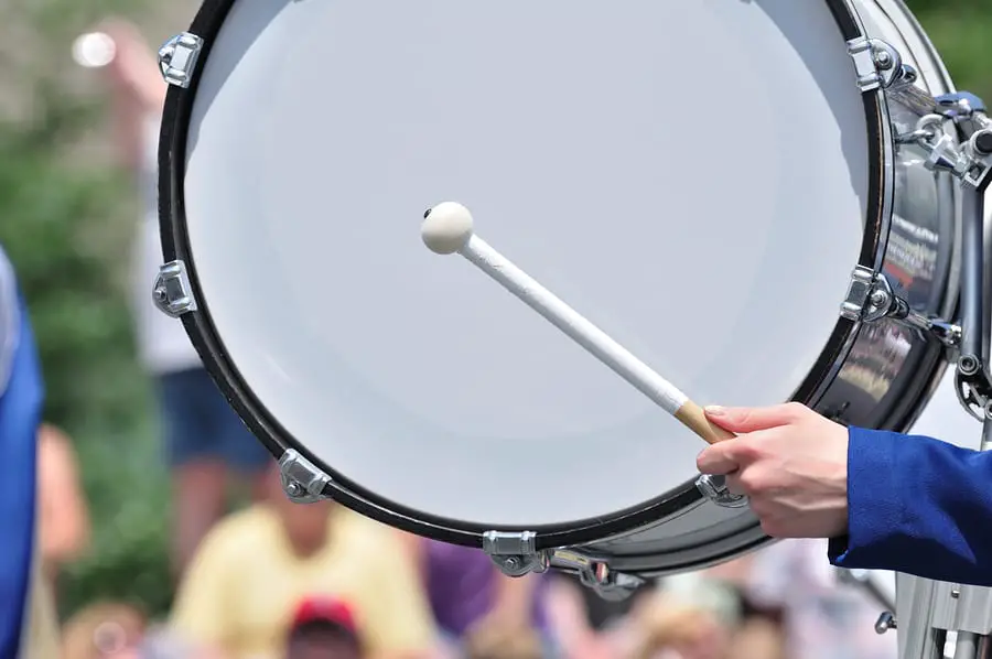 Description: Bass Drum Playing in the Marching Band - X8 Drums & Percussion, Inc